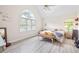 Bright bedroom with vaulted ceiling, large window, and light wood flooring at 959 Vendue Dr, Lawrenceville, GA 30044