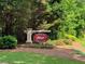 Entrance to Flowers Crossing neighborhood, with a stone-based sign at 959 Vendue Dr, Lawrenceville, GA 30044