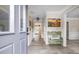Bright and inviting foyer with light-colored walls, a decorative bench, and hardwood floors at 959 Vendue Dr, Lawrenceville, GA 30044