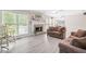 Comfortable living room with large windows, stone fireplace, and cozy seating arrangement at 959 Vendue Dr, Lawrenceville, GA 30044