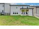 Back of house with a yard, covered patio, and well-maintained lawn at 1620 Branthaven Ln, Auburn, GA 30011