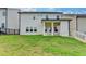 Spacious backyard featuring a covered patio and lush green lawn at 1620 Branthaven Ln, Auburn, GA 30011