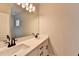 Bright bathroom featuring double vanity, white cabinets, and matte black fixtures at 1620 Branthaven Ln, Auburn, GA 30011