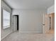 Carpeted bedroom bathed in natural light showcases ample windows and ensuite door at 1620 Branthaven Ln, Auburn, GA 30011
