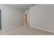 Neutral bedroom with plush carpet, ensuite doors, and freshly painted walls at 1620 Branthaven Ln, Auburn, GA 30011
