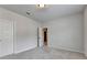 Bright, carpeted bedroom with two doors and neutral walls provides a cozy and versatile space at 1620 Branthaven Ln, Auburn, GA 30011