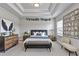 Virtually Staged: Elegant bedroom with modern decor and tray ceiling at 1620 Branthaven Ln, Auburn, GA 30011