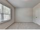 Comfortable bedroom with a large window, carpet, and natural light offers a serene retreat at 1620 Branthaven Ln, Auburn, GA 30011