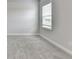 Neutral toned bedroom with plush carpet and a bright window at 1620 Branthaven Ln, Auburn, GA 30011
