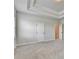 Bright bedroom features neutral walls, plush carpet, and a stylish tray ceiling at 1620 Branthaven Ln, Auburn, GA 30011