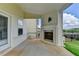 Beautiful covered patio with a brick fireplace, providing a cozy outdoor living space at 1620 Branthaven Ln, Auburn, GA 30011