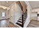 Entryway with hardwood floors and view to the staircase at 1620 Branthaven Ln, Auburn, GA 30011
