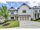 Beautiful two-story home with a two-car garage, manicured lawn, and lovely curb appeal at 1620 Branthaven Ln, Auburn, GA 30011