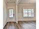 Welcoming foyer with wood floors, and a glass-paneled front door and sidelight, creating a bright entrance at 1620 Branthaven Ln, Auburn, GA 30011