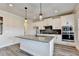 Beautiful kitchen island with granite countertops and stainless steel appliances at 1620 Branthaven Ln, Auburn, GA 30011
