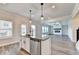 Modern kitchen features a spacious island with sink and dishwasher, along with stainless steel appliances at 1620 Branthaven Ln, Auburn, GA 30011