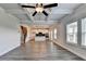 Spacious living room with coffered ceilings, wood flooring, and windows providing natural light at 1620 Branthaven Ln, Auburn, GA 30011