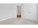 Bright bedroom with carpet and a double closet with white doors, showcasing ample storage at 1768 Evenstad Way, Smyrna, GA 30080