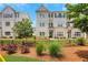 Charming townhome showcasing craftsman-style architecture, professional landscaping, and a welcoming front entrance at 1768 Evenstad Way, Smyrna, GA 30080