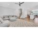 Spacious living area features plush seating, hardwood floors, and view into other areas of the home at 1768 Evenstad Way, Smyrna, GA 30080