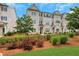 Attractive townhouses boast brick and siding exteriors, fenced yards, and lush landscaping offering appealing curb appeal at 1768 Evenstad Way, Smyrna, GA 30080