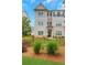 Beautiful townhouse featuring brick and siding, a fenced yard, and well-maintained landscaping creating appealing curb appeal at 1768 Evenstad Way, Smyrna, GA 30080