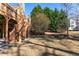 Landscaped backyard with lush grass, a charming wood staircase and bordering mature trees, enhancing privacy at 2041 Democracy Dr, Buford, GA 30519