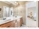 Bathroom with double sink vanity, granite countertops, and a large mirror at 2041 Democracy Dr, Buford, GA 30519