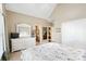 Spacious bedroom with white furniture, ceiling fan, ensuite bathroom, and a walk-in closet at 2041 Democracy Dr, Buford, GA 30519