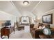 Spacious bedroom with comfortable seating area and canopy bed at 2041 Democracy Dr, Buford, GA 30519