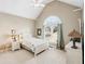 Charming bedroom with vaulted ceiling, featuring a cozy bed, large window, and stylish décor at 2041 Democracy Dr, Buford, GA 30519