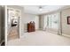 Bedroom with neutral carpet flooring, natural light and access to a hallway at 2041 Democracy Dr, Buford, GA 30519