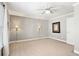 Neutral bedroom featuring sconce lighting, an art print, and white trim at 2041 Democracy Dr, Buford, GA 30519