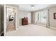 Bedroom with an attached hallway, a dresser, a ceiling fan, and neutral paint at 2041 Democracy Dr, Buford, GA 30519