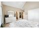 Spacious bedroom with white furniture, large window, and serene ambiance with access to adjacent rooms at 2041 Democracy Dr, Buford, GA 30519