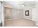 Empty bedroom with neutral paint, carpet flooring, ceiling fan and natural light at 2041 Democracy Dr, Buford, GA 30519