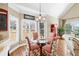 Bright dining area with glass table, lots of natural light, and comfortable seating at 2041 Democracy Dr, Buford, GA 30519