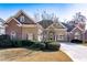 Attractive home with a well-kept lawn, mature landscaping, and a welcoming facade at 2041 Democracy Dr, Buford, GA 30519