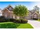 Charming single-Gathering home with a well-manicured lawn, mature trees, and a stone and siding exterior at 2041 Democracy Dr, Buford, GA 30519