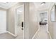 Neutral hallway with access to an office space and a bedroom with carpet flooring at 2041 Democracy Dr, Buford, GA 30519