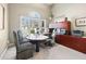 Spacious home office with custom built-ins, a large desk, and ample natural light at 2041 Democracy Dr, Buford, GA 30519