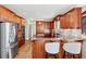 Modern kitchen with stainless steel appliances, granite countertops, and custom cabinetry at 2041 Democracy Dr, Buford, GA 30519
