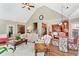 Bright living room with fireplace seamlessly connected to dining area and kitchen at 2041 Democracy Dr, Buford, GA 30519