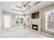 Bright living room features a fireplace, white trim, and lots of light at 2041 Democracy Dr, Buford, GA 30519