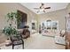 Spacious living room features high ceilings, an area rug, and a view into the fireplace at 2041 Democracy Dr, Buford, GA 30519