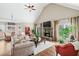 Open concept living area with fireplace, hardwood floors, and lots of natural light at 2041 Democracy Dr, Buford, GA 30519