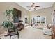 Bright living room with large windows, high ceilings, and comfortable seating at 2041 Democracy Dr, Buford, GA 30519