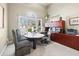 Bright home office with large window, built-in cabinets, desk and a comfortable office chair at 2041 Democracy Dr, Buford, GA 30519