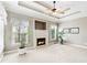 Sitting room features a cozy fireplace, natural light, and neutral color palette at 2041 Democracy Dr, Buford, GA 30519
