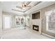 Bright sitting room with fireplace, backyard access, and neutral color palette at 2041 Democracy Dr, Buford, GA 30519